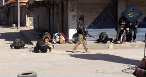 This image posted on the Twitter page of Syria's al-Qaida-linked Nusra Front on Saturday April 25, 2015, which is consistent with AP reporting, apparently shows fighters praying after rebel fighters from Islamic factions  including the Nusra Front captured the town of Jisr al-Shughour from Syrian government forces, in Idlib province, Syria. Hard-line Syrian rebel groups entered the strategic town Saturday in northwestern Syria, sending government troops fleeing after intense clashes that have seen them take nearly all of a crucial province. (Al-Nusra Front Twitter page via AP)