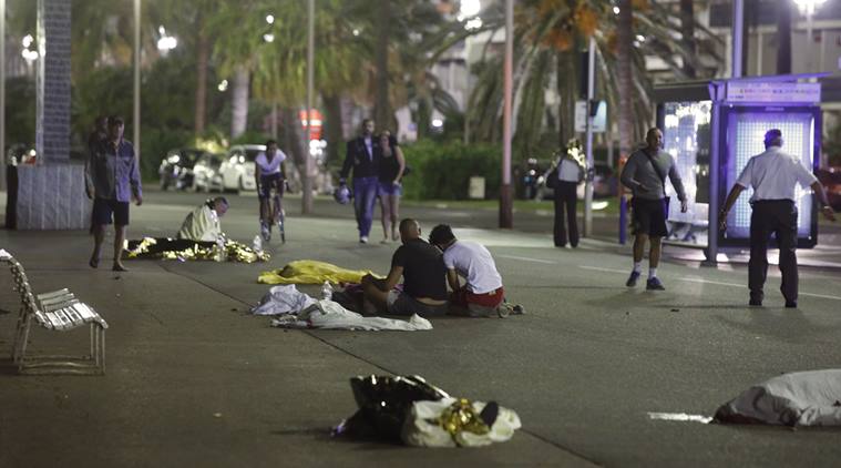 Bodies are seen on the ground after at least 30 people were killed in the southern French town of Nice when a truck ran into a crowd celebrating the Bastille Day national holiday